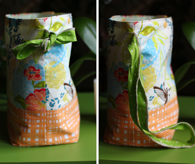Two image collage of a floral hummingbird patterned project bag with an orange hatchmarked boxed bottom and an apple green polka dotted side loop that is tied up in a bow (left image) or can be let down to sling over a shoulder (right image).