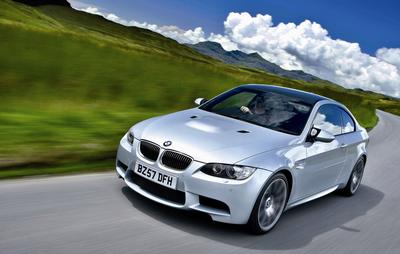 bmw m3 driving on road