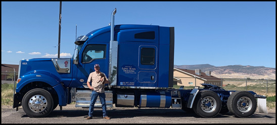 Larry Martin stands with his 2019 Kenworth W990