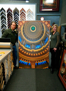 David Ryan and Wendy mitchell standing with large 4 x 6' photograph