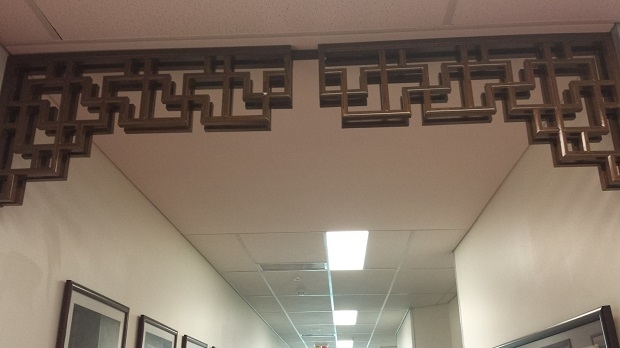 Swastikas hanging from a ceiling in a lattice structure, International Building of the Griffith University.