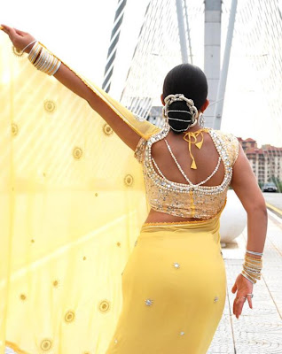 Charmi in yellow Saree back show