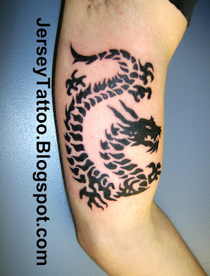 Tribal dragon tattoo Tribal dragon done under the arm a great choice for a
