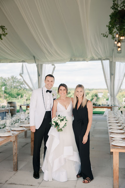 Niagara Wedding Planner - A Divine Affair - Maggie & Nik - Gemini Photography - Elegant Winery Weddings at Ravine Vineyard. Tented Reception with outdoor ceremony. Oyster shucking, Photo Booth and Live band. Harvest tables with chiffon runner and garland of greenery.