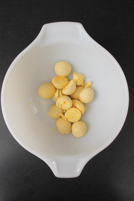 hard boiled egg yolks in a white bowl.