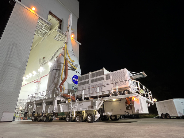 The transporter carrying the Orion Artemis 1 spacecraft exits from the Launch Abort System Facility to make its way to the Vehicle Assembly Building at NASA's Kennedy Space Center in Florida...on October 18, 2021.