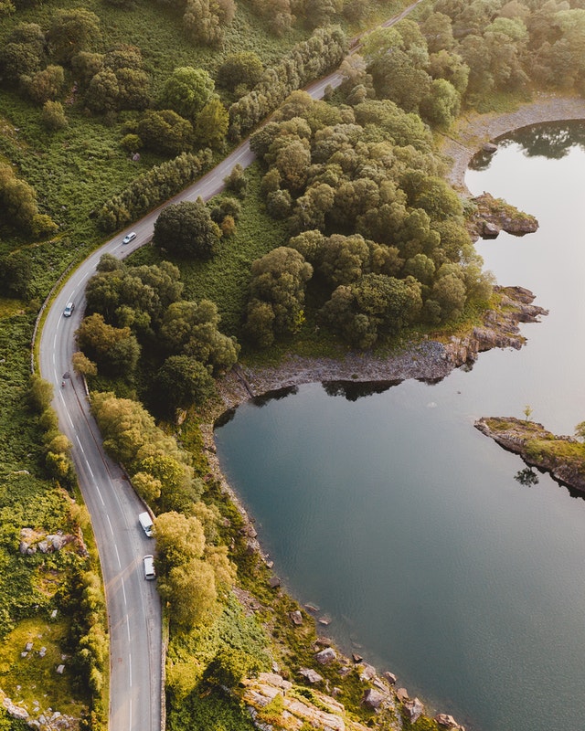 Aerial Photography of Roadway and Body of Water | Royalty Free Picture