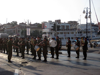 A Greek military band playing on the street in the morning.