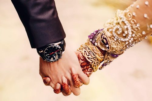 Punjabi Marriage Couple Holding Hands and groom holding hands