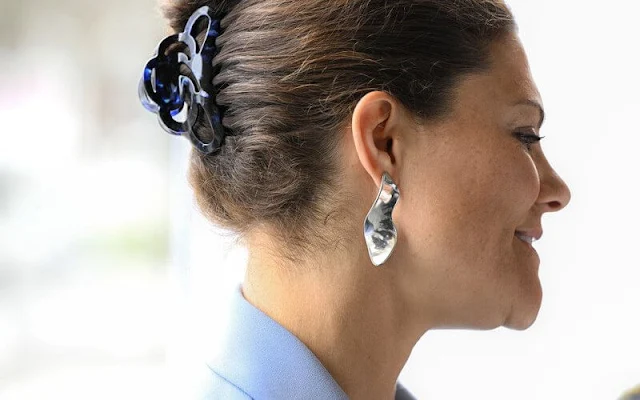 Crown Princess Victoria wore a light-blue Ayden wrap blazer by Andiata. Linda Fallenius earrings