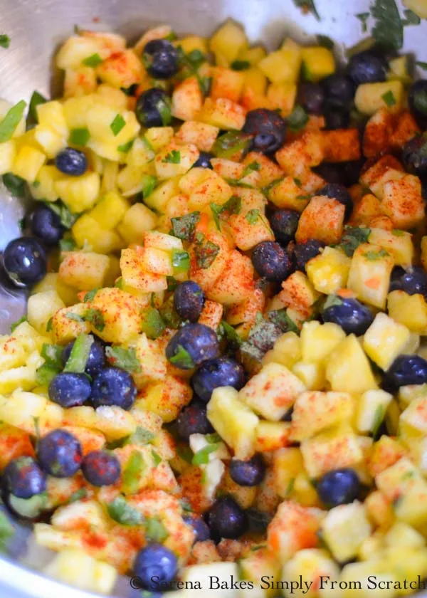 Pineapple Blueberry Salsa add chili powder, smoked paprika, garlic, and salt.