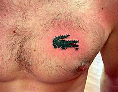 Small Alligator tattoo on chest. Small Alligator tattoo on chest.
