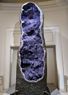 Purple amethyst crystals exposed in a 12-foot tall geode, cut open, American Museum of Natural History, New York, New York