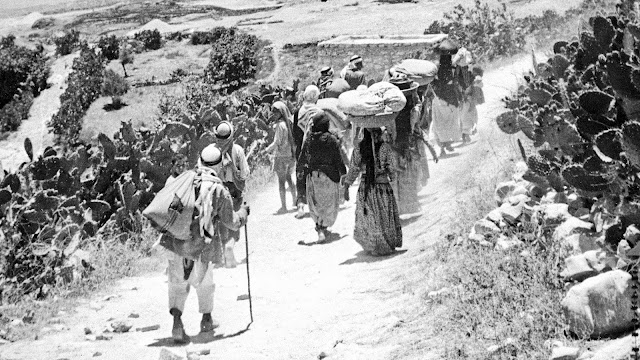 Palestinian refugees fleeing on foot