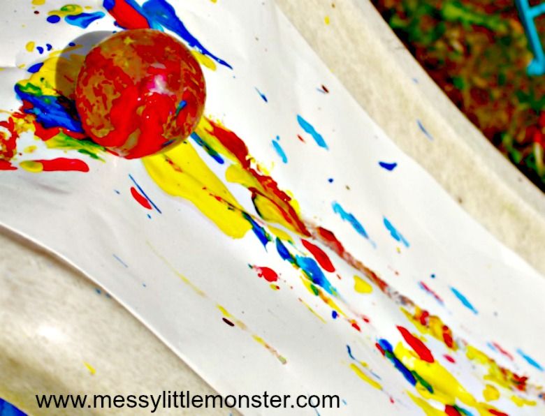 Paint rolling on a slide messy play