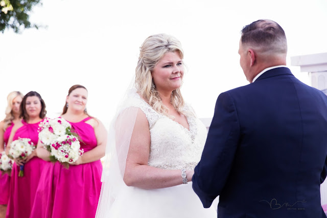 bride during vows at new baltimore waterfront wedding