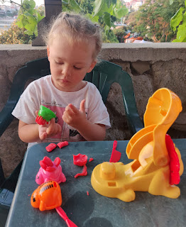 Rosie playing with play doh