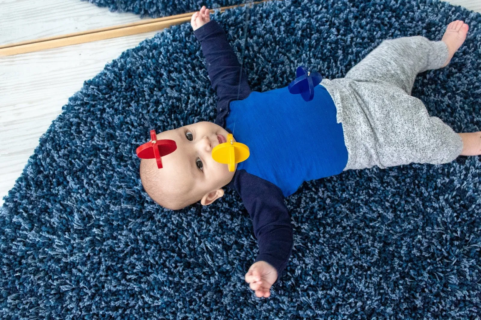 A look at Montessori friendly options for a baby that is interested in batting at toys. Some options include a primary colors mobile.