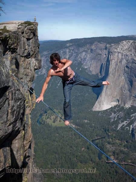 Online but busy funny picture, man standing on the rope . the world record of walking on the single rope 