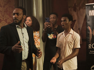 We Have A Ghost. (L to R) Anthony Mackie as Frank, Erica Ash as Melanie, Niles Fitch as Fulton, Jahi Winston as Kevin in We Have A Ghost. Cr. Scott Saltzman/Netflix © 2022.