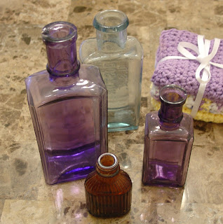 four antique medicine bottles Vicky bought at the Cameron Antiques Street Fair