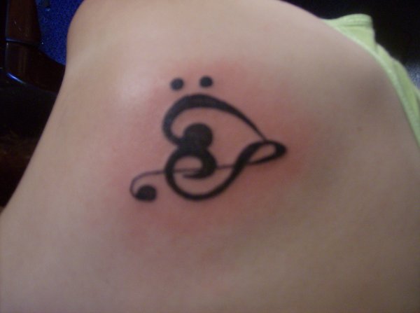 ITS A DESIGN OF HEART AND MUSIC THIS GIRL WANTED A TATTOO WHICH 