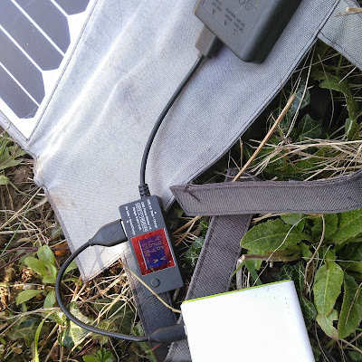 Close-up of solar panel hooke dup to battery with USB power monitor