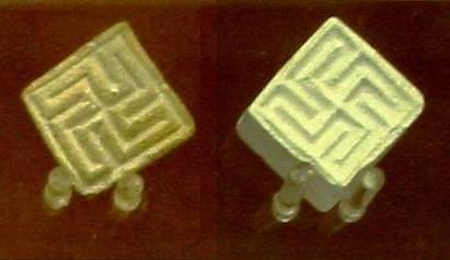 Stamp or seal in the shape of a swastika. From the Indus Valley Civilization site of Mohenjo-Daro.