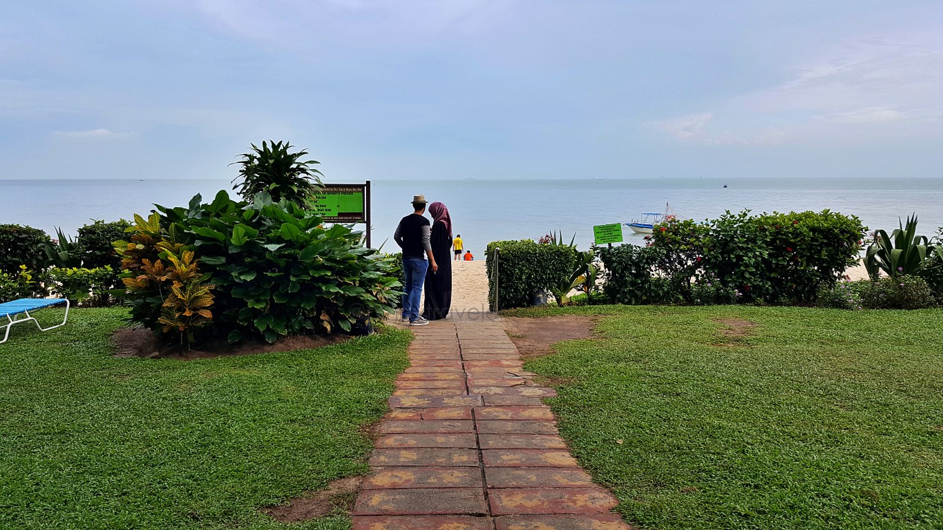 Holiday Inn garden near the sand at Batu Ferringhi Beach, Georgetown, Penang, Malaysia
