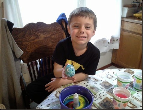 Aidan coloring eggs