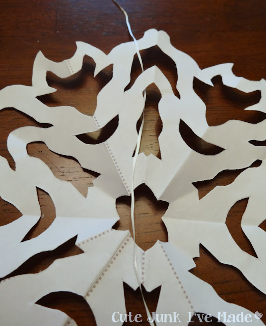 Paper Snowflake Curtain Tutorial - Snowflake on Dental Floss