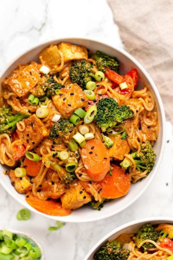 These healthy vegan red curry noodle bowls are flavorful, saucy and easy to make! Served with vegetables, crispy tofu, and gluten-free noodles too!