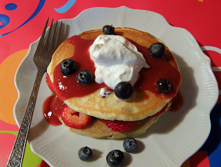 Stack of Blueberry Pancakes with Strawberry Sauce