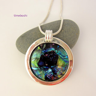 https://umeboshi.indiemade.com/product/blue-nebula-handmade-dichoic-fused-glass-cabochon-jewelry-pendant-blue-green-silver-plated-s