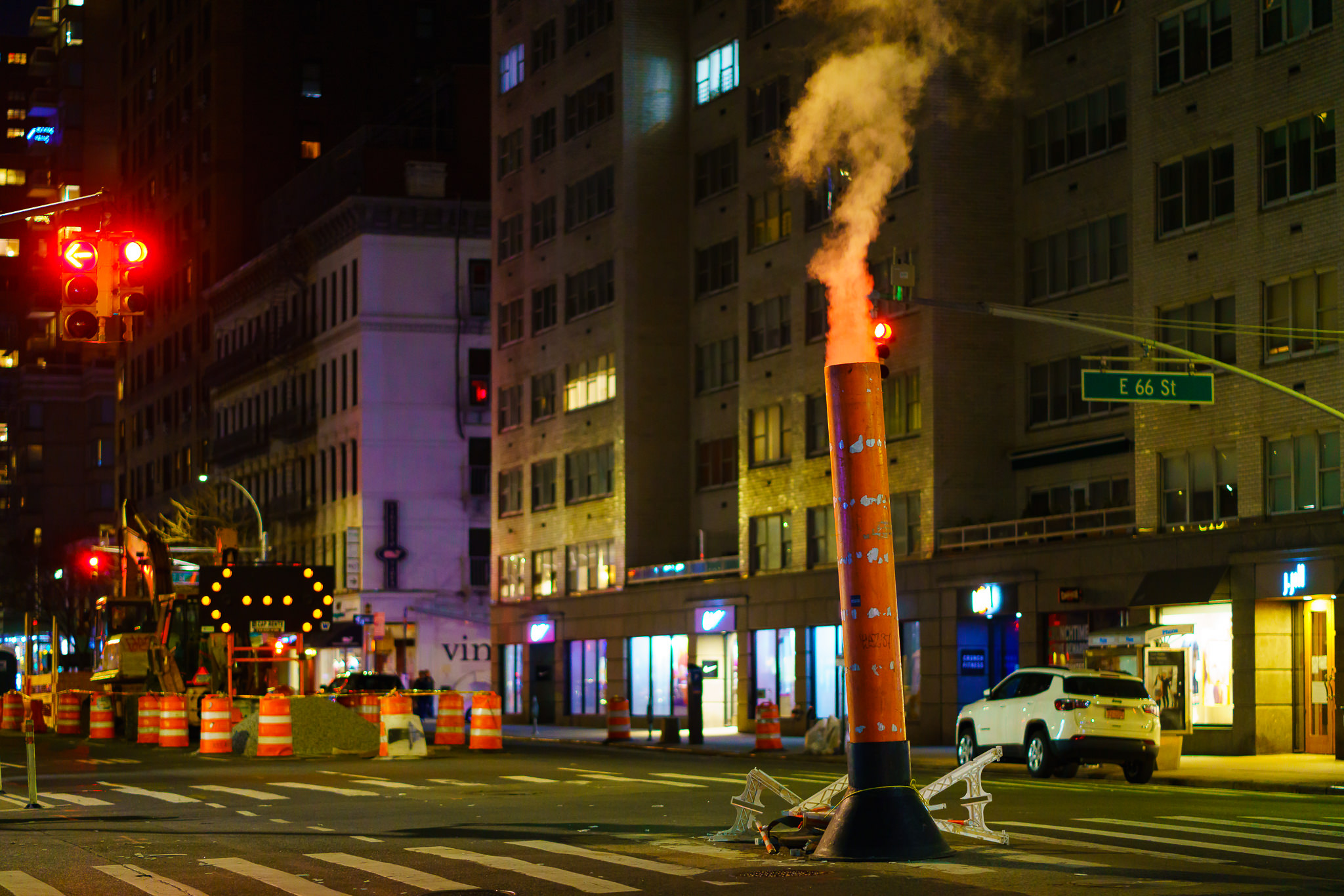 a photo of a steam pipe on a manhattan new york avenue at night
