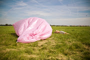 They are all taped together forming a big pillow baloon that he inflated it . (spink baloon kidsleeping)