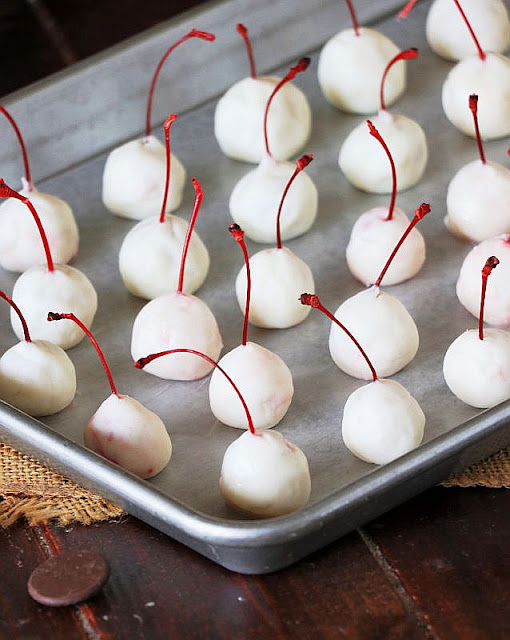 Baking Sheet of Maraschino Cherries with Stems Wrapped in Homemade Chocolate Covered Cherry Filling Dough Image