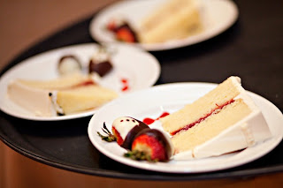 Wedding cake slices with chocolate covered strawberries