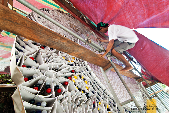 A Worker Preparing a Giant Lantern in Pampanga