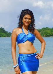 Shraddha Das Hot Navel show in blue dress on Beach Hot Pics