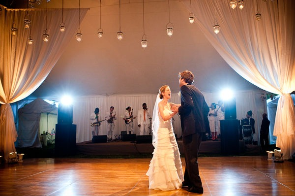 A line of hanging lanterns really makes a statement at this wedding 