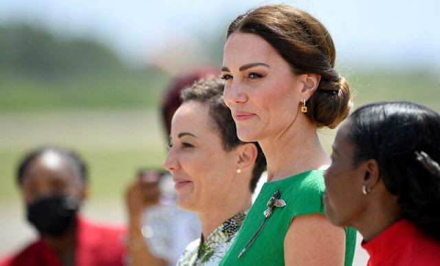 Kate Middleton wore a green Denver midi dress by Emilia Wickstead. Queen's Hummingbird Brooch. Kiki McDonough citrine earrings