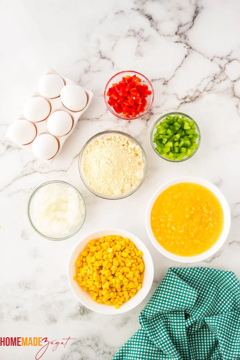 Eggs, bell peppers, corn mix, corn butter. Ingredients needed for pie, distributed out