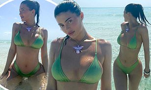 Kylie Jenner shows off her tiny waist in a mint green string bikini while in the Bahamas with Kim Kardashian