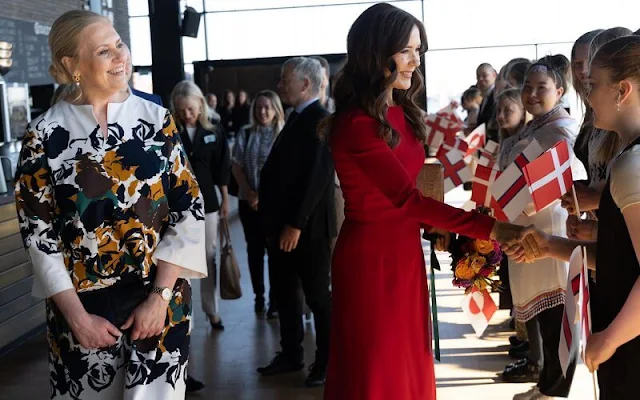Crown Princess Mary wore a red contrast stitch cady midi dress by Dolce and Gabbana. Dulong Anello pearl earrings