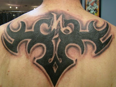 Tribal capricorn tattoos on back