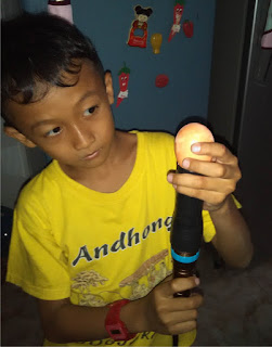 Boy try egg candlin