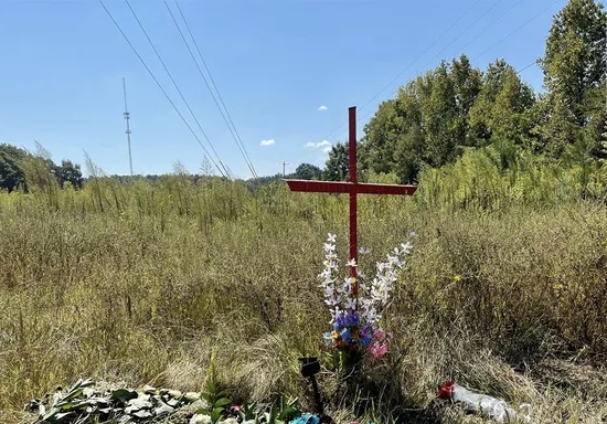 A cross was set up close to the electrical cables where Verse Woods and Devin Clark were found dead with shot injuries by a couple of ATV riders throughout the end of the week. (Audrey Conklin)