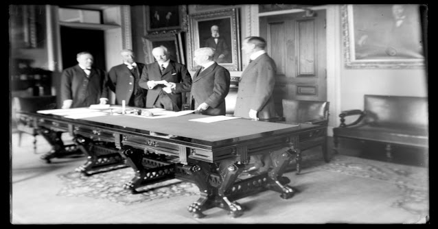 Signing of a check to the Danish government for the US-Denmark Gold Deal, marking the purchase of the Danish West Indies (now U.S. Virgin Islands) in March 1917, Washington, D.C.