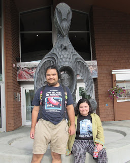 TG and William at the Raven statue at the Alaska Native Heritage Center
